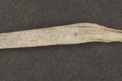 This strip of lead is known as a “came.” These pieces held the glass panes of casement windows together.